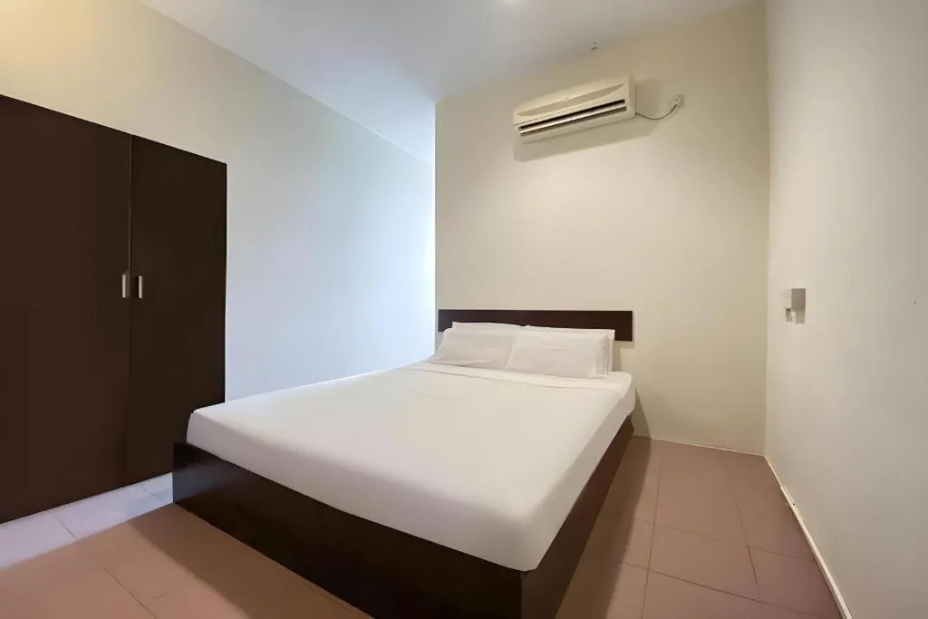 Bed in SPOT ON 91178 Motel Impian