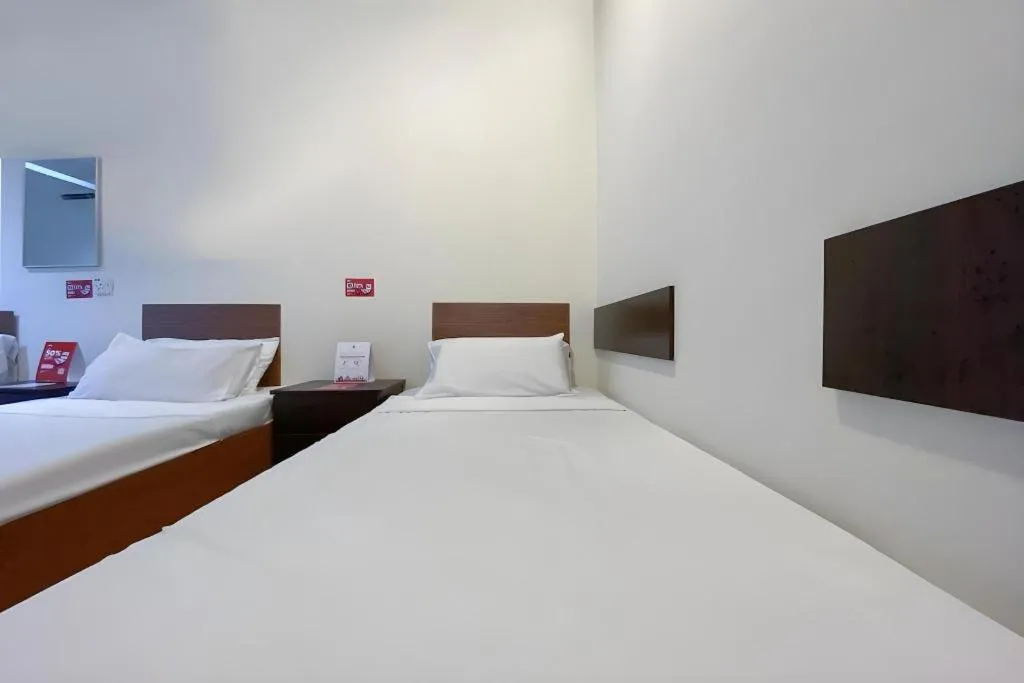 Bed in SPOT ON 91178 Motel Impian