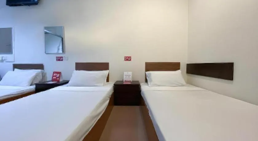 Bed in SPOT ON 91178 Motel Impian