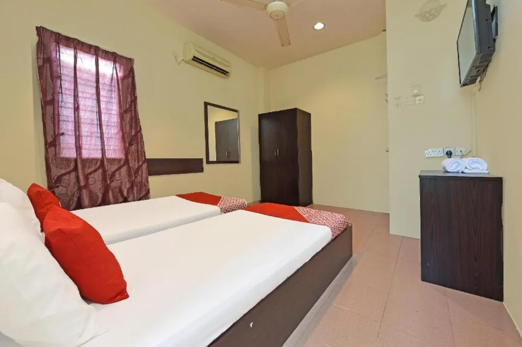 Bed in SPOT ON 91178 Motel Impian