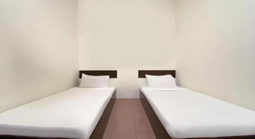 Bed in SPOT ON 91178 Motel Impian