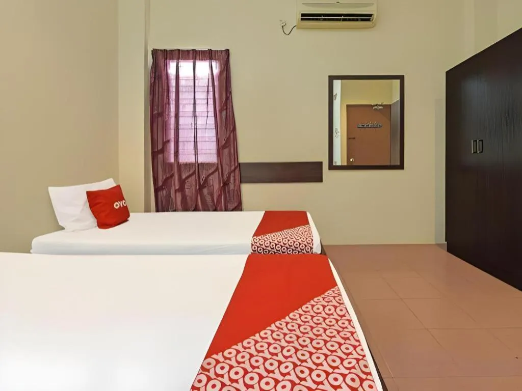 Bed in SPOT ON 91178 Motel Impian