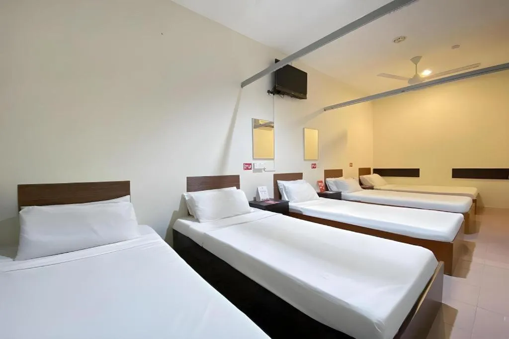 Bed in SPOT ON 91178 Motel Impian