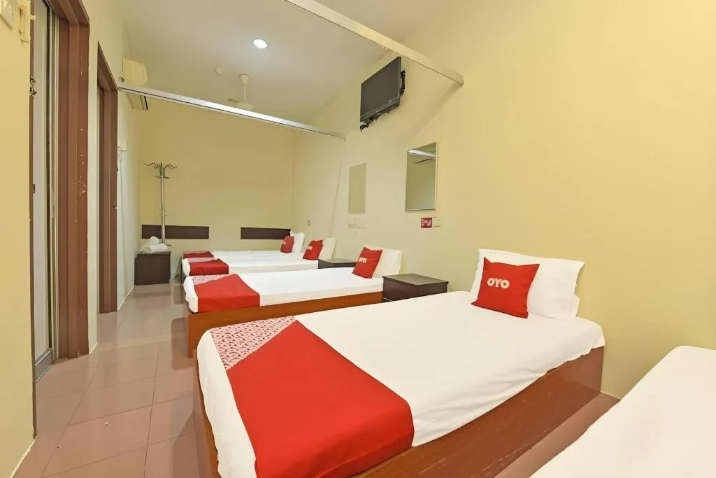 Bed in SPOT ON 91178 Motel Impian