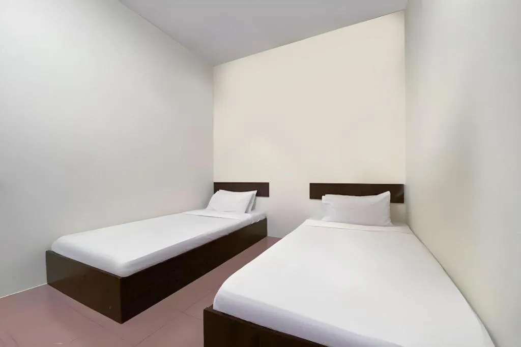 Bed in SPOT ON 91178 Motel Impian