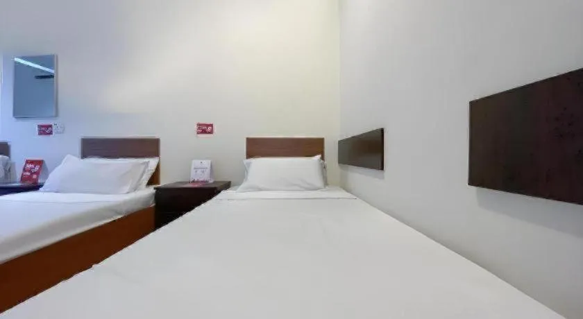 Bed in SPOT ON 91178 Motel Impian