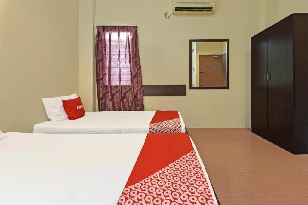 Bed in SPOT ON 91178 Motel Impian