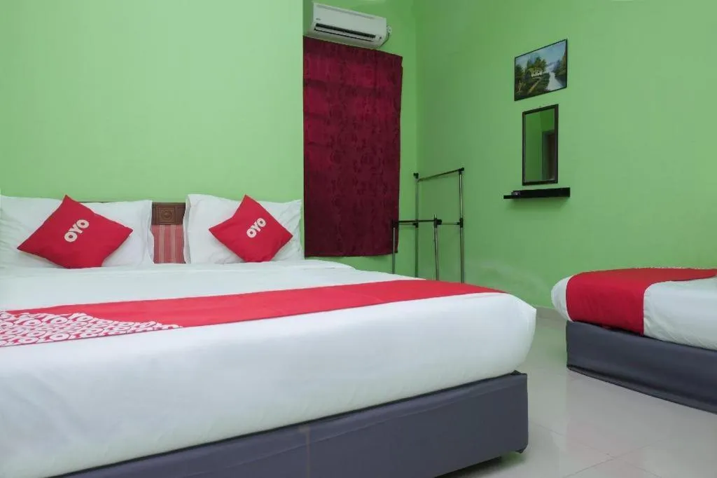 Bed in OYO 90018 River Village Hotel