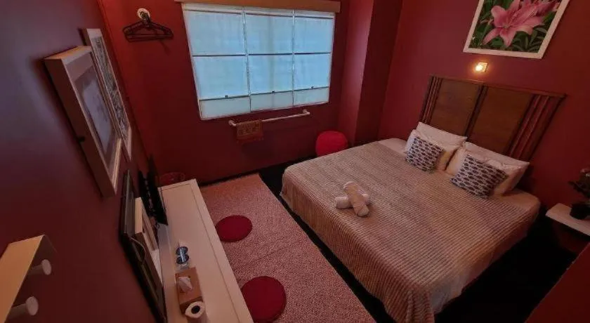 Bed in Oyasumi Hotel