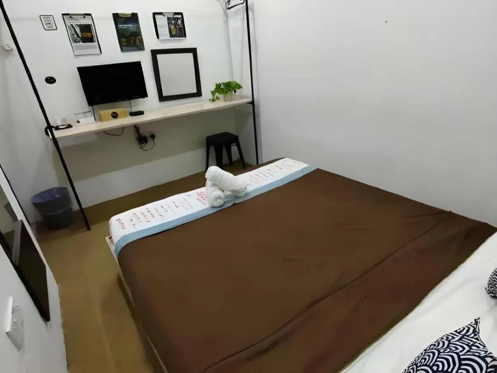 Bed in Oyasumi Hotel