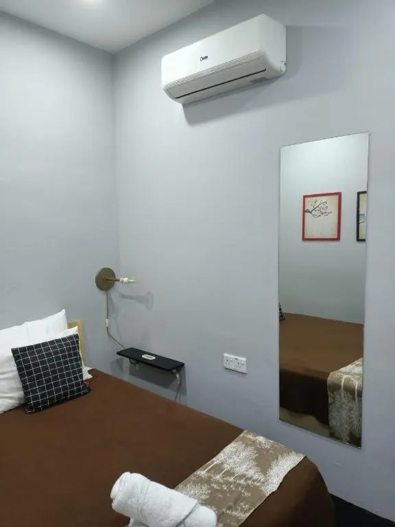 Bed in Oyasumi Hotel