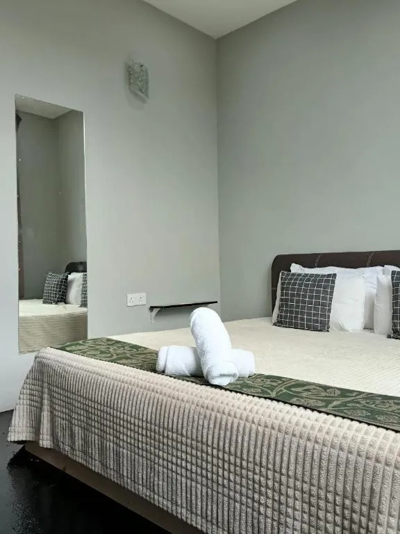 Bed in Oyasumi Hotel