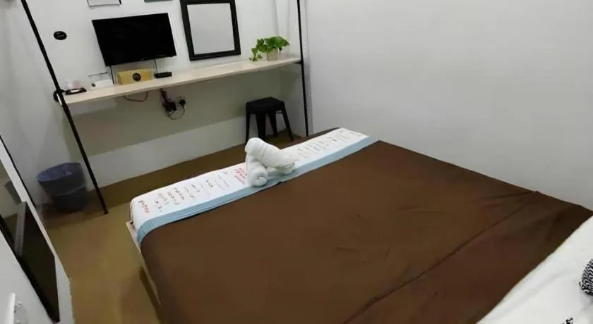 Bed in Oyasumi Hotel