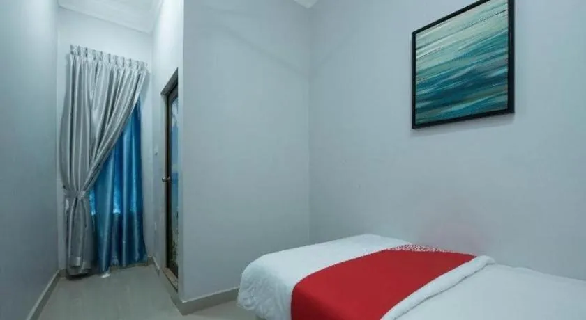 Bed in OYO 90234 Sungai Rengit City Resort 2