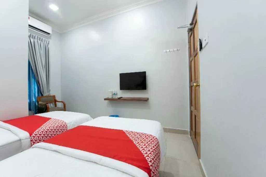Bed in OYO 90234 Sungai Rengit City Resort 2