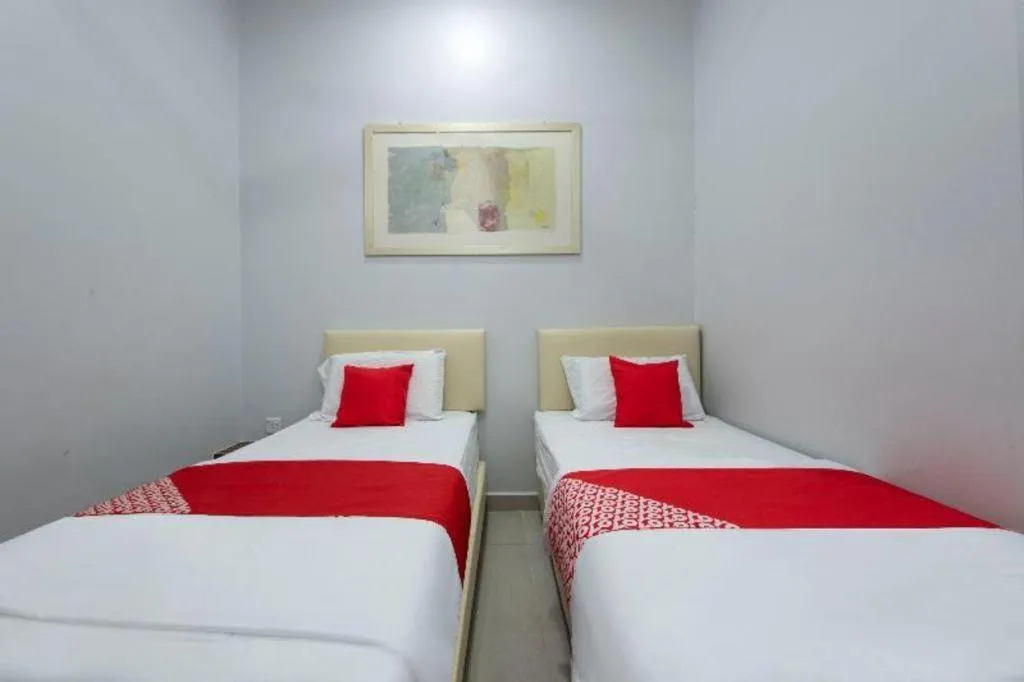 Bed in OYO 90234 Sungai Rengit City Resort 2