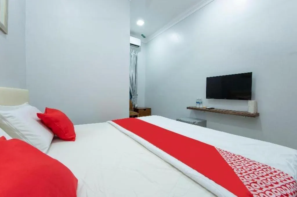Bed in OYO 90234 Sungai Rengit City Resort 2