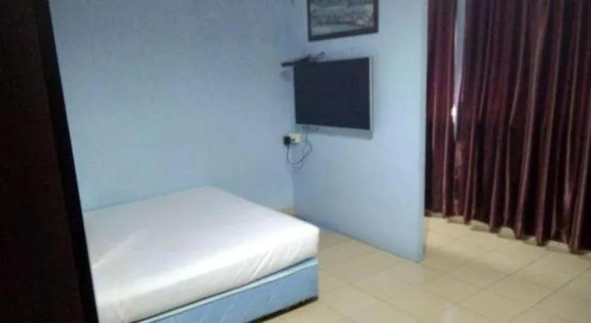 Bed in OYO 90376 Centre Point Hotel