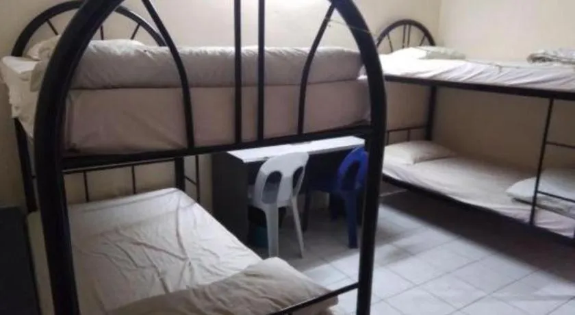 Bed in OYO 90376 Centre Point Hotel