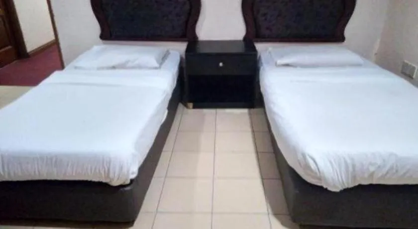 Bed in OYO 90376 Centre Point Hotel