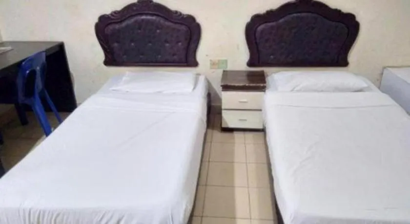 Bed in OYO 90376 Centre Point Hotel