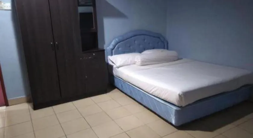 Bed in OYO 90376 Centre Point Hotel