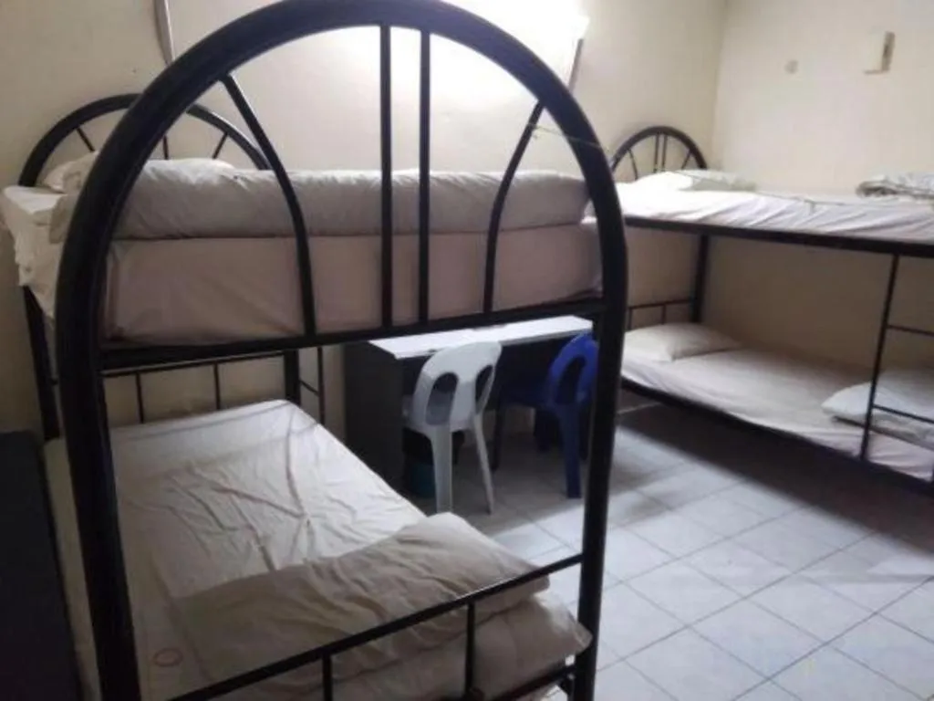 Bed in OYO 90376 Centre Point Hotel