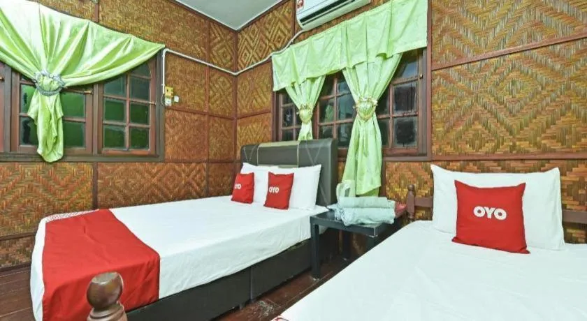 Bed in OYO 90620 Mahseer Chalet