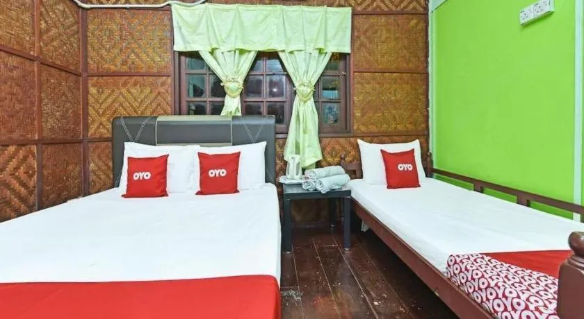 Bed in OYO 90620 Mahseer Chalet