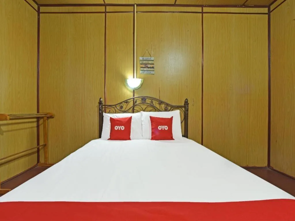Bed in OYO 90620 Mahseer Chalet