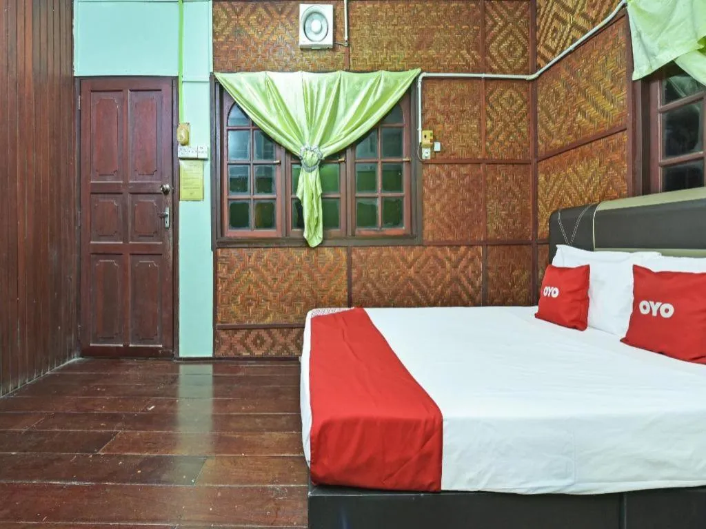 Bed in OYO 90620 Mahseer Chalet