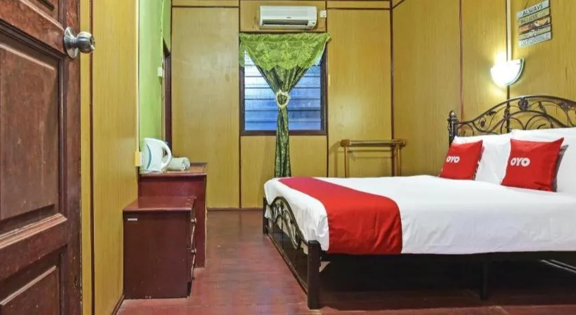 Bed in OYO 90620 Mahseer Chalet