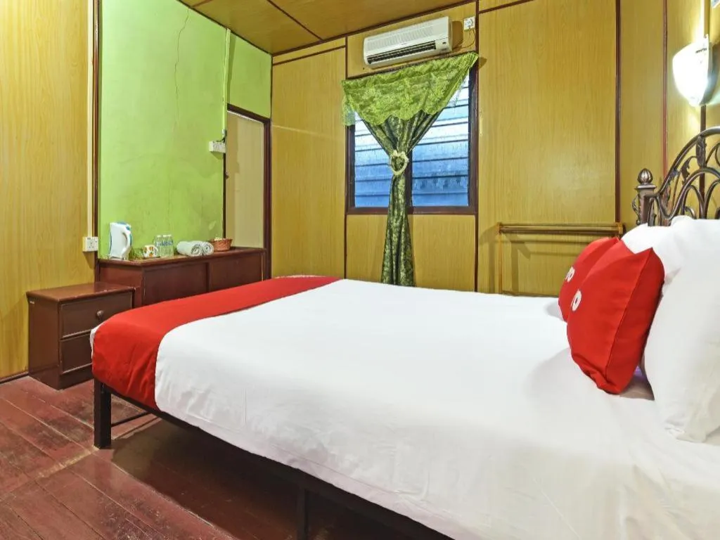 Bed in OYO 90620 Mahseer Chalet