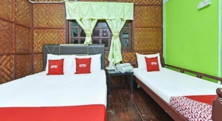 Bed in OYO 90620 Mahseer Chalet