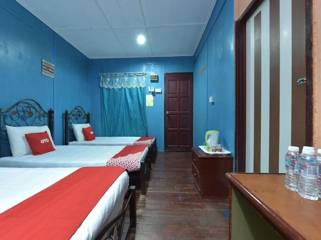Bed in OYO 90620 Mahseer Chalet