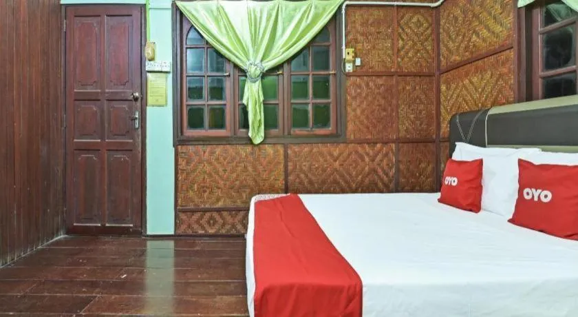 Bed in OYO 90620 Mahseer Chalet