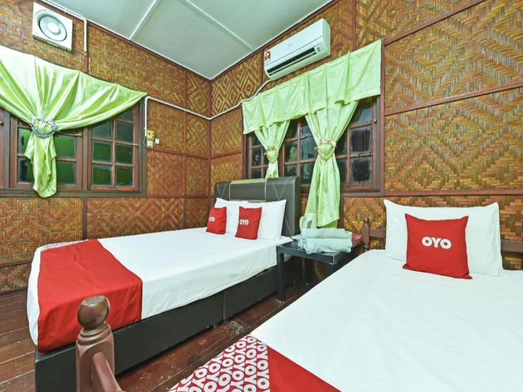 Bed in OYO 90620 Mahseer Chalet