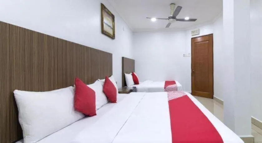 Bed in OYO 90623 Thank Q Inn 3