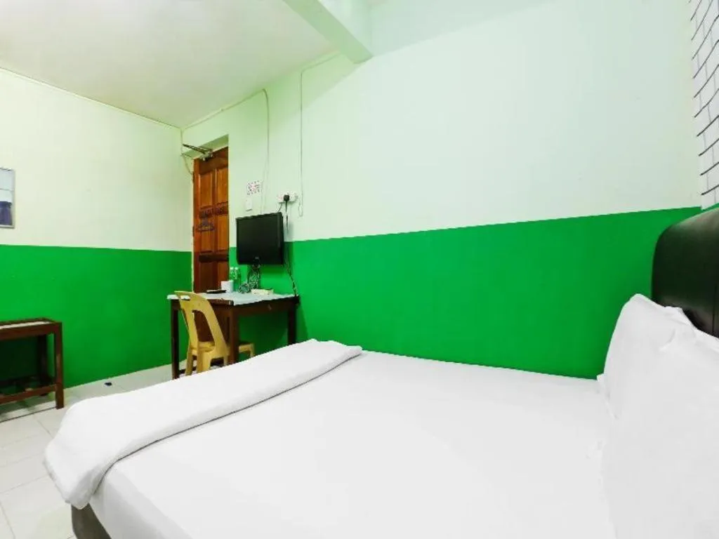 Bed in OYO 90623 Thank Q Inn 3