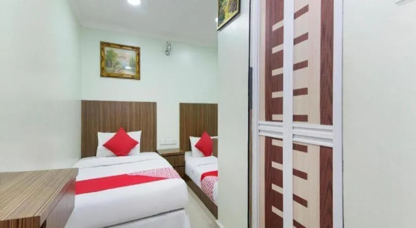 Bed in OYO 90623 Thank Q Inn 3