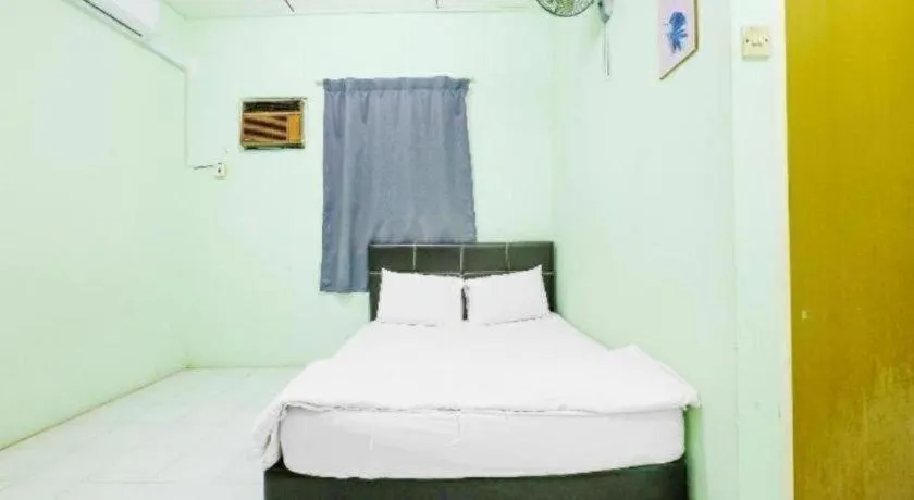 Bed in OYO 90623 Thank Q Inn 3