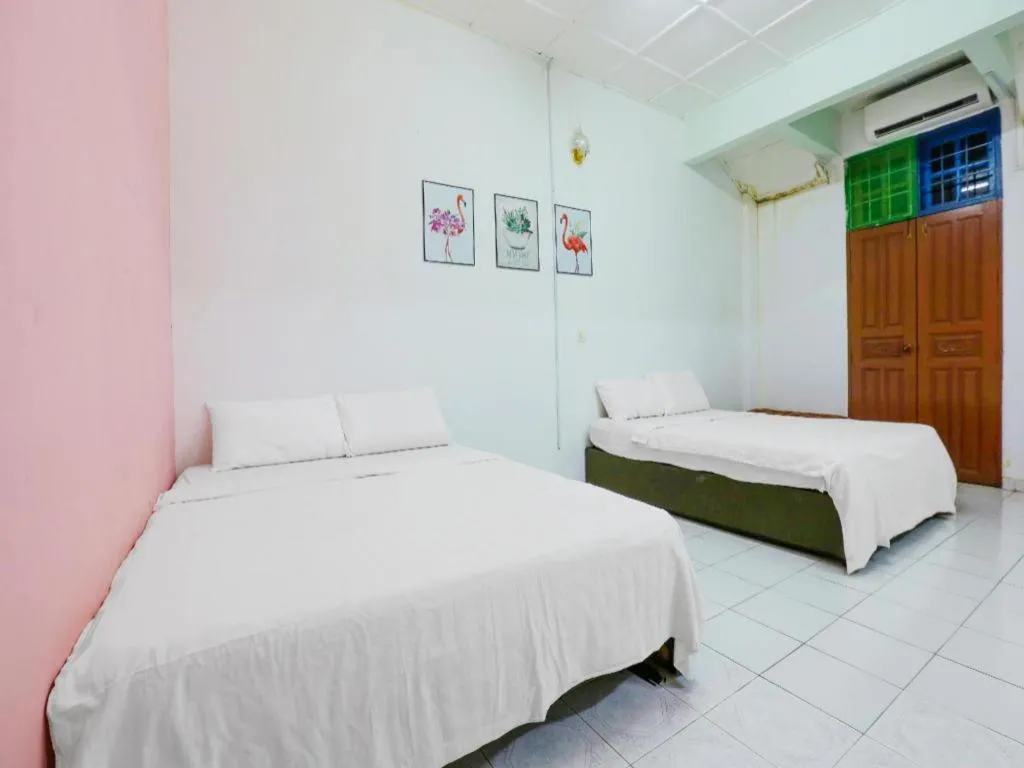 Bed in OYO 90623 Thank Q Inn 3