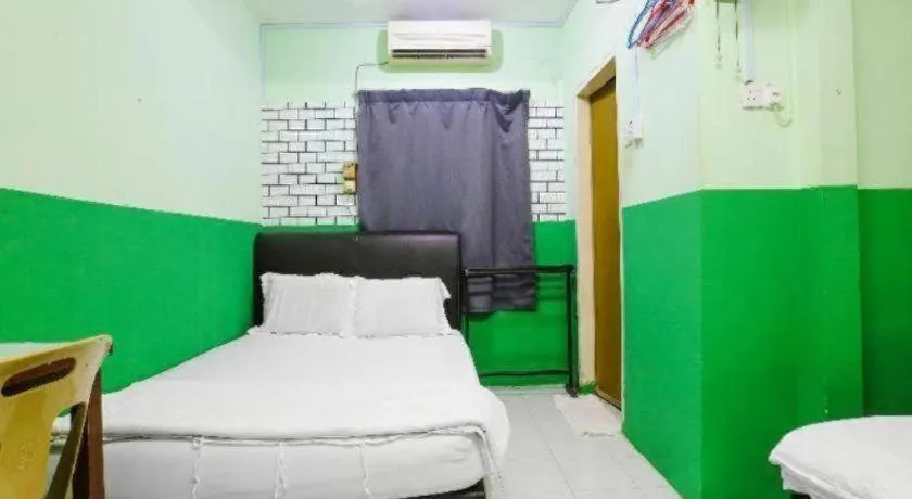 Bed in OYO 90623 Thank Q Inn 3