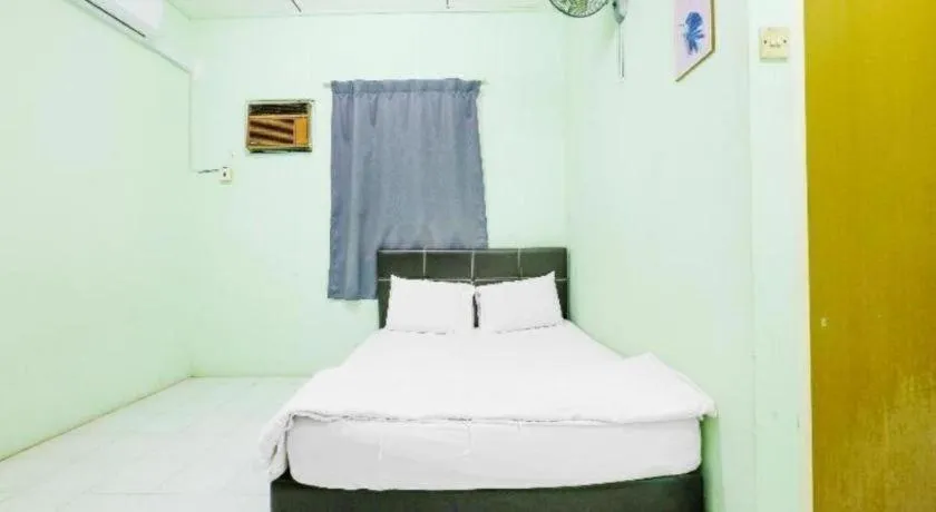 Bed in OYO 90623 Thank Q Inn 3