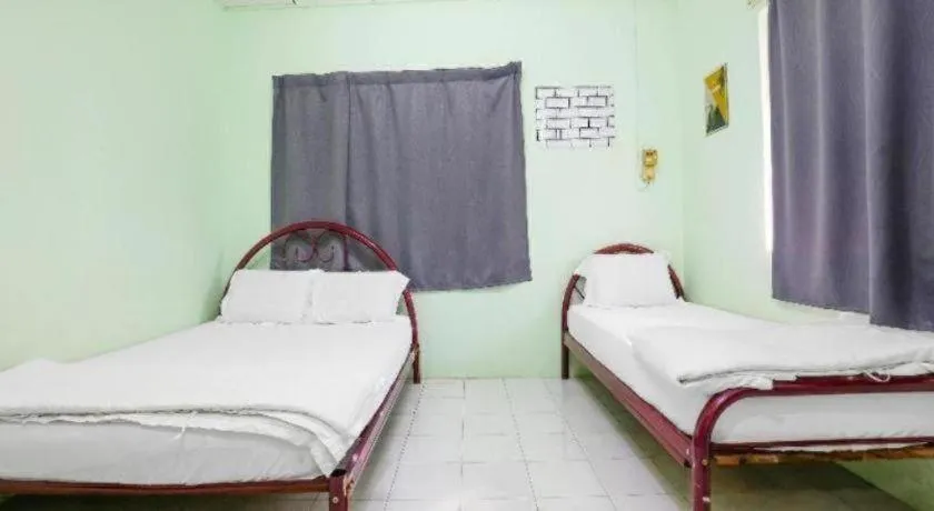 Bed in OYO 90623 Thank Q Inn 3