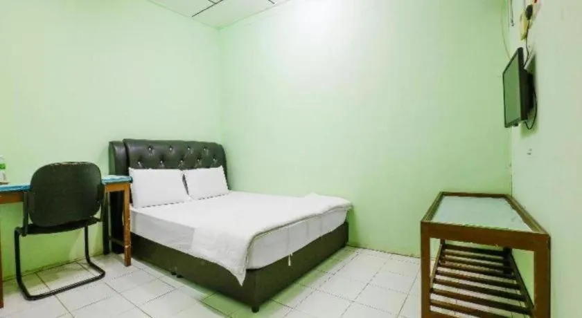 Bed in OYO 90623 Thank Q Inn 3