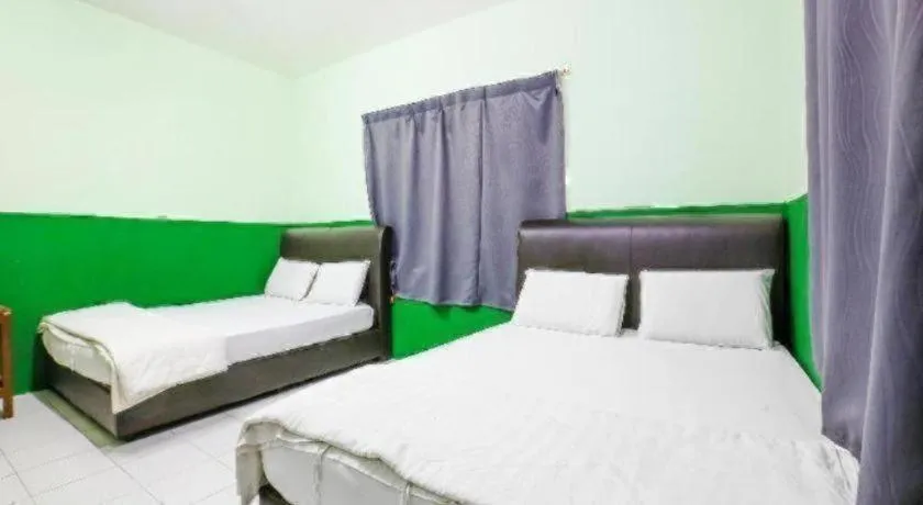 Bed in OYO 90623 Thank Q Inn 3