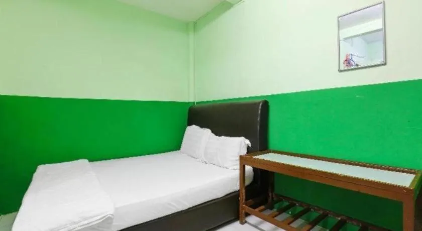 Bed in OYO 90623 Thank Q Inn 3