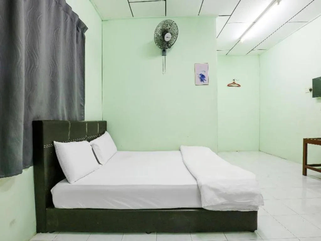 Bed in OYO 90623 Thank Q Inn 3