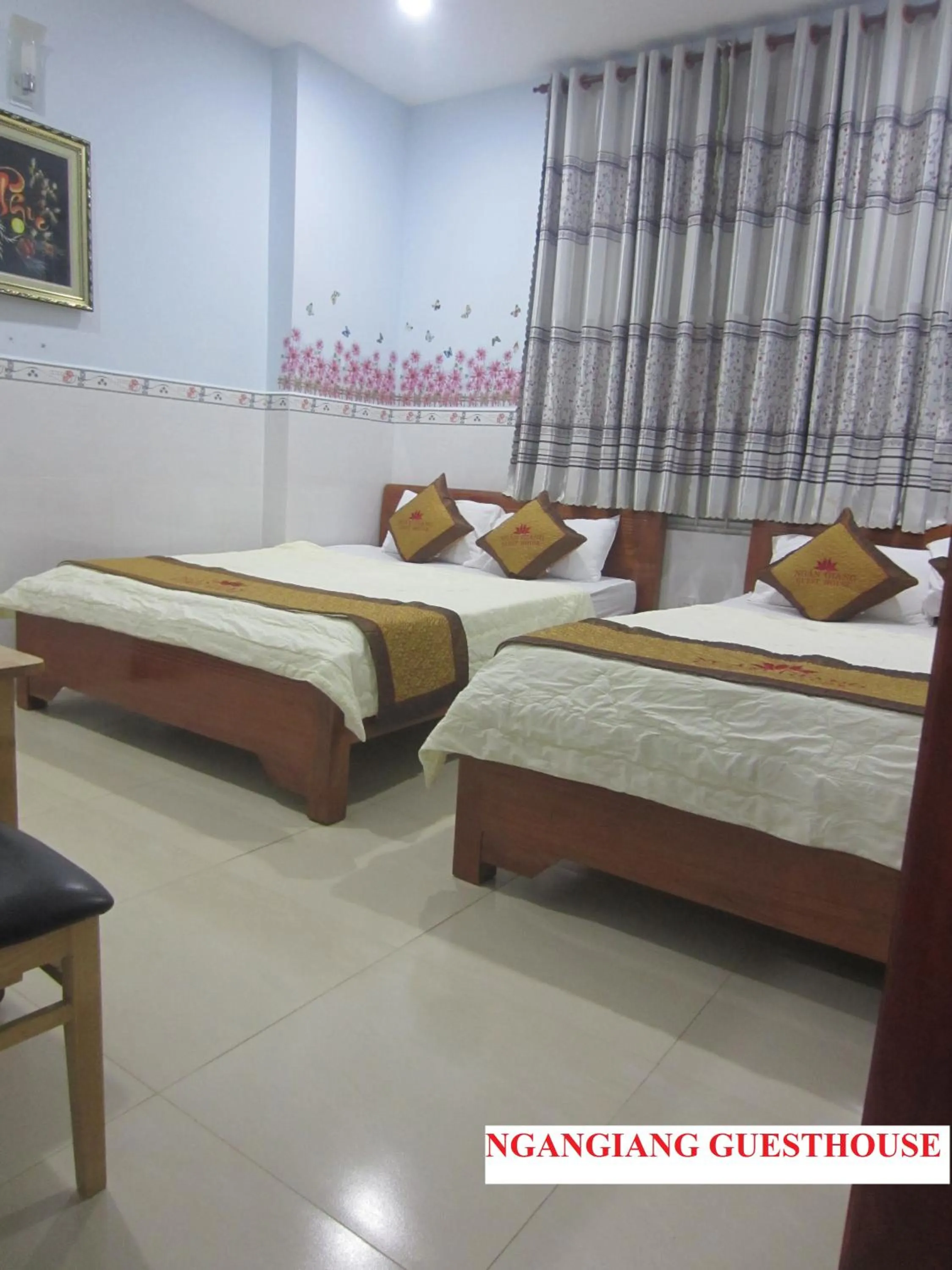 Photo of the whole room, Bed in Ngan Giang Guesthouse